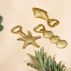 Décapsuleur en fer doré - Coquillage