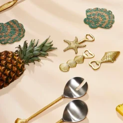 Décapsuleur en fer doré - Coquillage