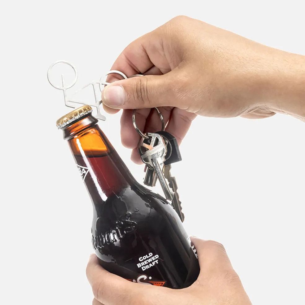 Porte cle decapsuleur velo